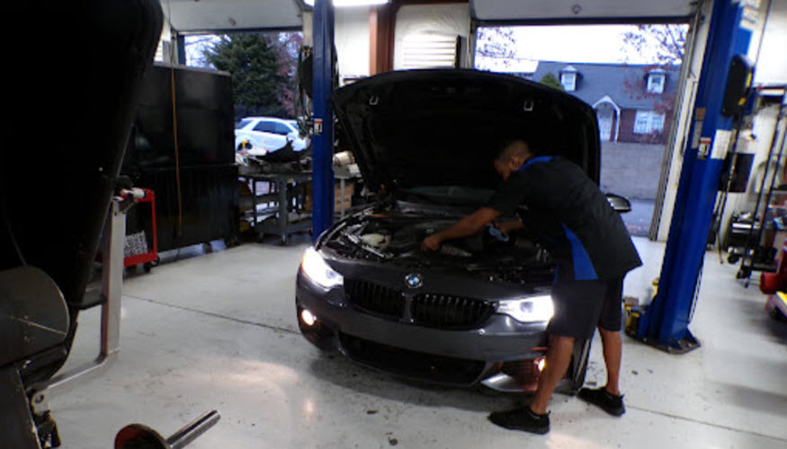 Certified Mechanic Checking BMW Engine